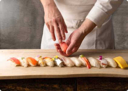 Sushi chef preparing sushi